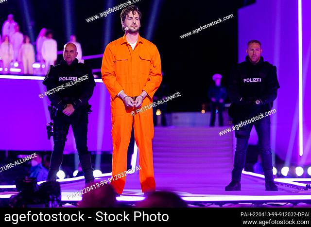 13 April 2022, North Rhine-Westphalia, Essen: Alexander Klaws, singer, is on stage as Jesus in RTL's Easter production ""The Passion"" on Burgplatz