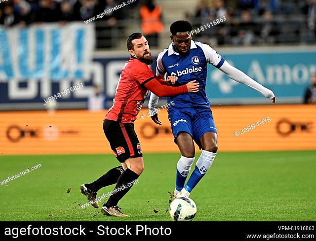 Rwdm's Xavier Mercier and Gent's Mathias Nurio Fortuna fight for the ball during a soccer match between KAA Gent and RWDM Racing White Daring Molenbeek