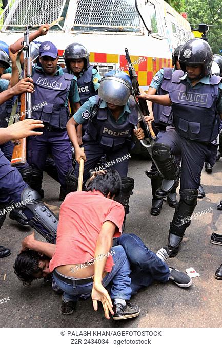 Dhaka 10 May 2015: Police maul protesters during a march to besiege Dhaka police headquarters demanding action over the sexual assault on women during Pahela...