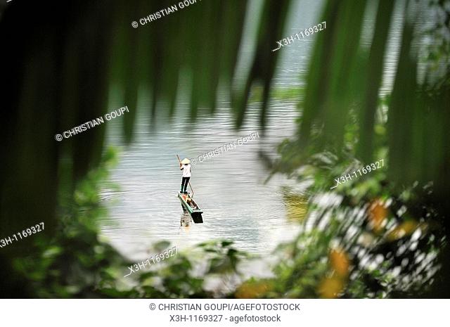 fisherwoman with a dugout canoe on Ba Be Lake, Bac Kan province, Northern Vietnam, southeast asia