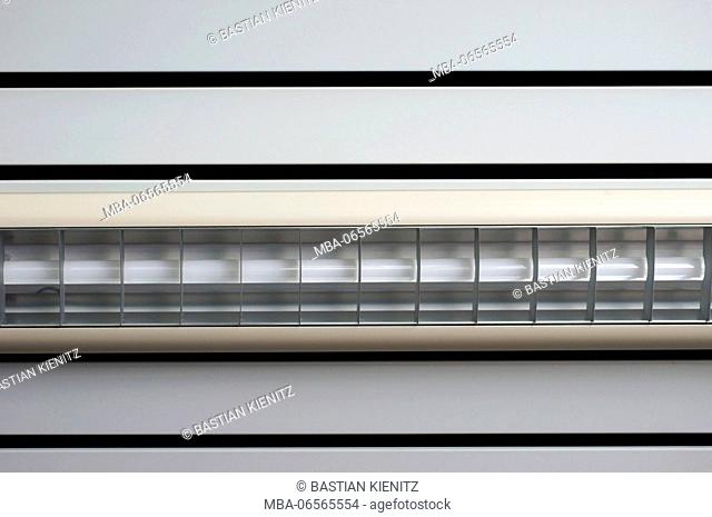 Photography of the bottom side of a ceiling lamp at a ceiling panel