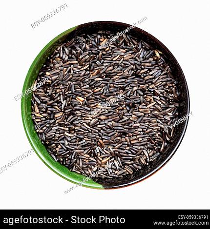 top view of whole-grain niger seeds (Guizotia Abyssinica) in round bowl isolated on white background