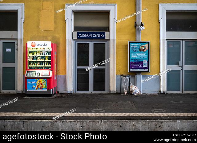 Avignon, Vaucluse, France, 12 29 2022 - Facade and platform of the central railway station with publicity and a selecta vending machine