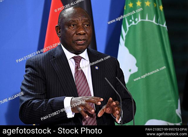 27 August 2021, Berlin: Cyril Ramaphosa, President of the South African Republic, speaks at a press conference after the G20 Compact with Africa conference at...
