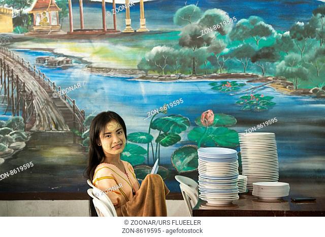 a women works in a restaurant in the Village of Thong Pha Phum north of the City of Kanchanaburi in Central Thailand in Southeastasia