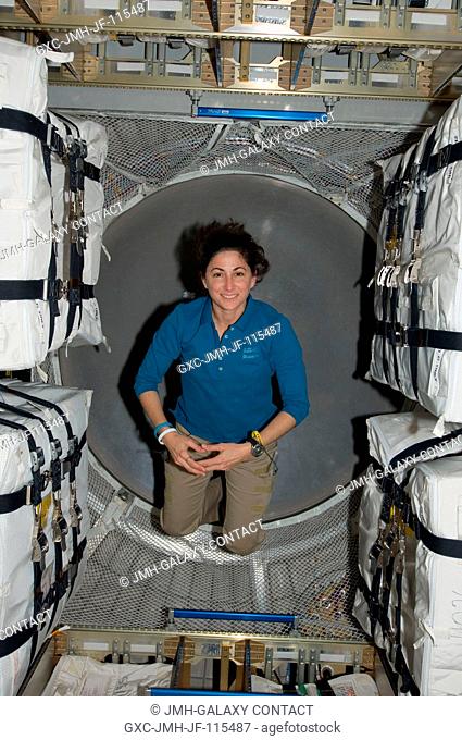 NASA astronaut Nicole Stott, STS-133 mission specialist, poses in the European Space Agency's Johannes Kepler Automated Transfer Vehicle-2 (ATV-2) while space...