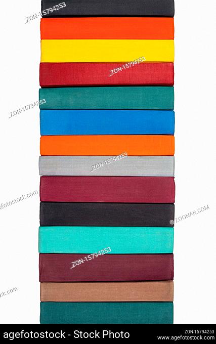 Stack of old hardcover books on bookshelf. Close-up view of multi-colored vintage hardback books. Objects isolated on white background