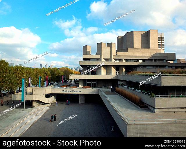 London, England - November 04, 2017: Peple walking along the concourse of the national theatre in London and on the pedestrian south bank of the river thames