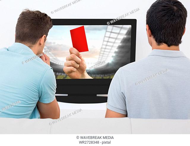 Friends watching soccer match on television