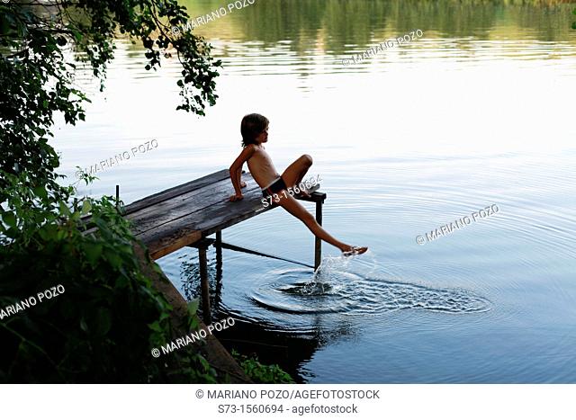 Girl on the pier in Lake Avral, Kirillovka, Samara Region, Russian Federation