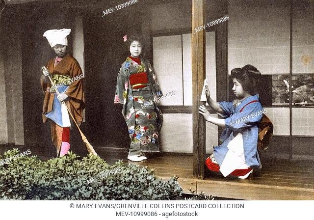 Japan - Geisha Girl - posing at her home with two house staff