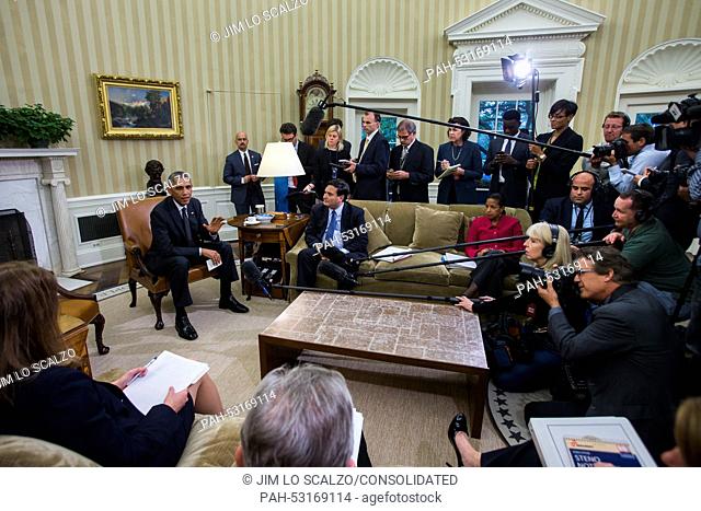 US President Barack Obama (L) speaks to the media after holding a meeting with his newly-appointed 'Ebola Response Coordinator' Ron Klain (center L)