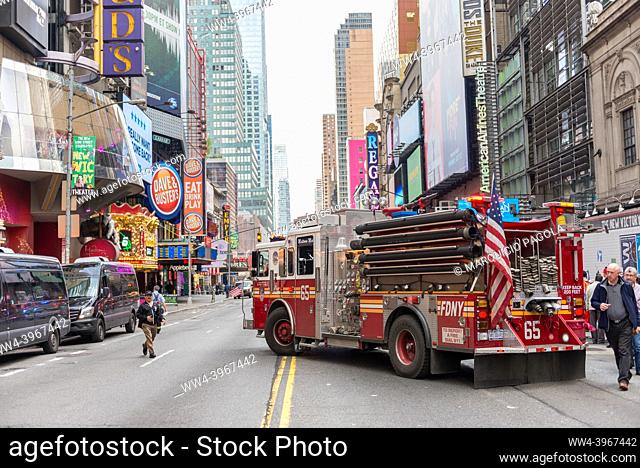 NEW YORK CITY, NY/USA - OCTOBER 16TH, 2014: Fire truck parked in the middle of W 42nd St Ave during an intervention in Times Square area, October 16th, 2014