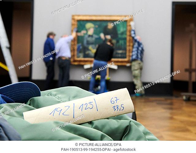 13 May 2019, Berlin: The dimensions of Manet's masterpiece ""Im Wintergarten"" are on a roll of paper. The picture will be hung by the exhibition technology...