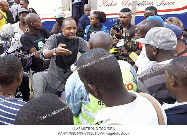 Political activist Boniface Mwangi explains his plans to his potential voters in Nairobi, Kenya, 12 June 2017. The son of a street hawker hopes to win a seat in...
