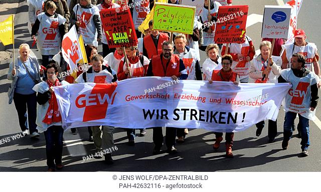 Participants in a demonstration of the trade union representing workers in education and science (GEW) protest in Magdeburg, Germany, 17 September 2013