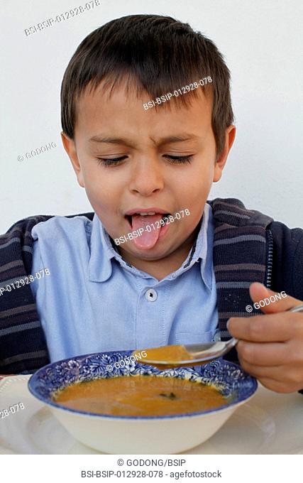 Child eating soup