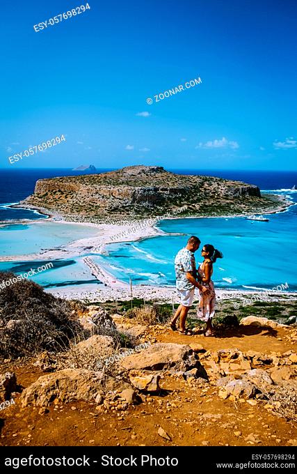 Crete Greece, Balos lagoon on Crete island, Greece. Tourists relax and bath in crystal clear water of Balos beach. Greece