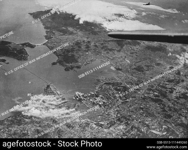 U.S. Flying Fortresses Raid German Submarine Base In France Smoke and flame rise from German submarine pans and repair facilities at Toulon, France, as U