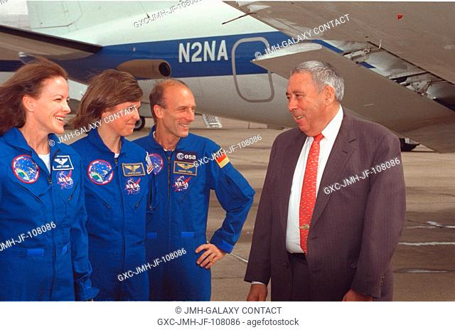 Three members of the STS-99 crew are greeted by JSC Director George W.S. Abbey following their arrival at Ellington Field, near the Johnson Space Center (JSC)