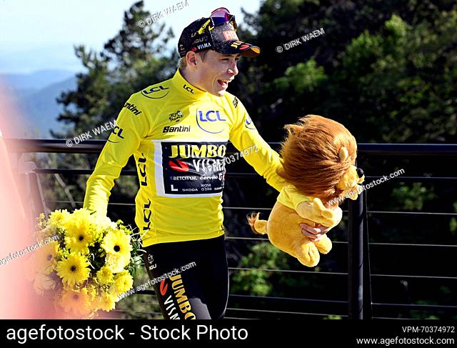 Danish Jonas Vingegaard of Jumbo-Visma celebrates on the podium in the yellow jersey of leader in the overall ranking after stage 9 of the Tour de France...