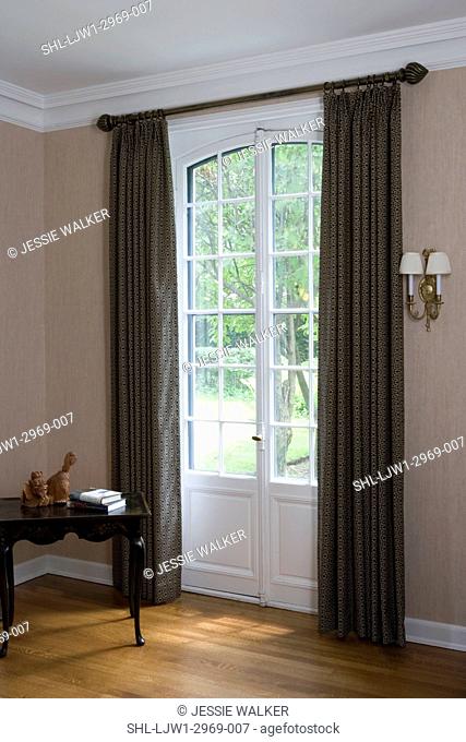 WINDOW TREATMENTS: wood floors, French doors, green curtains, white painted trim