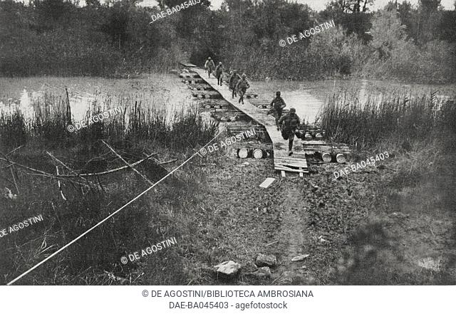A footbridge built on the river Piave for the passage of Italian troops, Battle of Piave, Italy, World War I, from l'Illustrazione Italiana, Year XLV, No 28