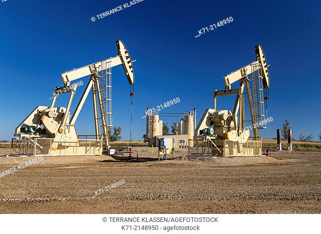 Oil pumpers in the Bakken play oil fields near Williston, North Dakota, USA
