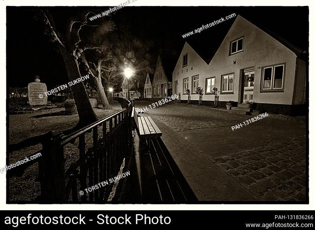 April 17th, 2020, Schleswig, the fishing settlement Holm in the Schleswig old town. B / W photo on a beautiful spring evening at dusk