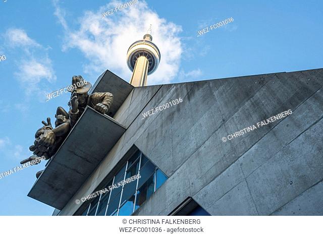 Canada, Ontario, Toronto, Facade of Rogers Center with sculptures, CN Tower, low angle view