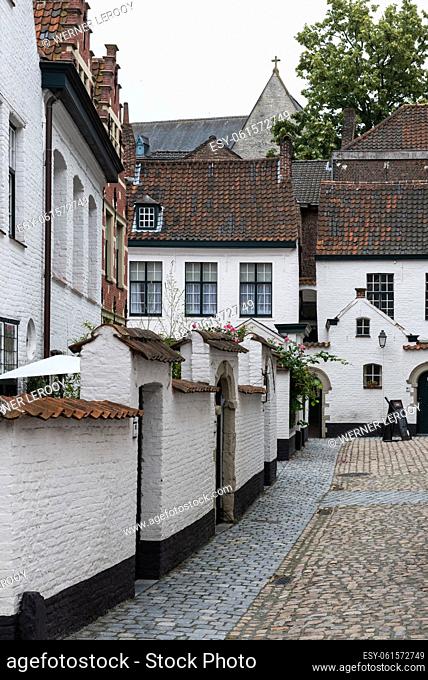 Kortrijk, West Flanders Region - Belgium. White painted brick stone facades of the beguinage