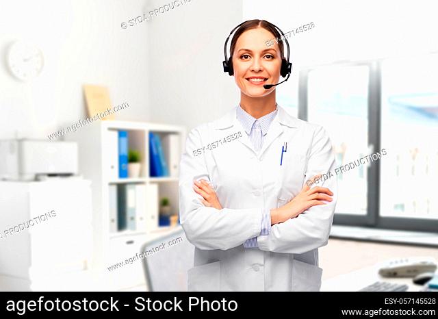smiling female doctor with headset at hospital