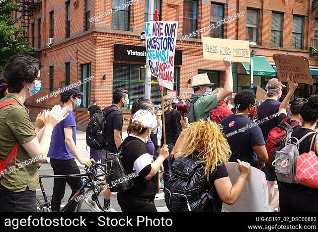 Protest marchers on the Harlem Families Black Lives Matter march in Harlem, New York City