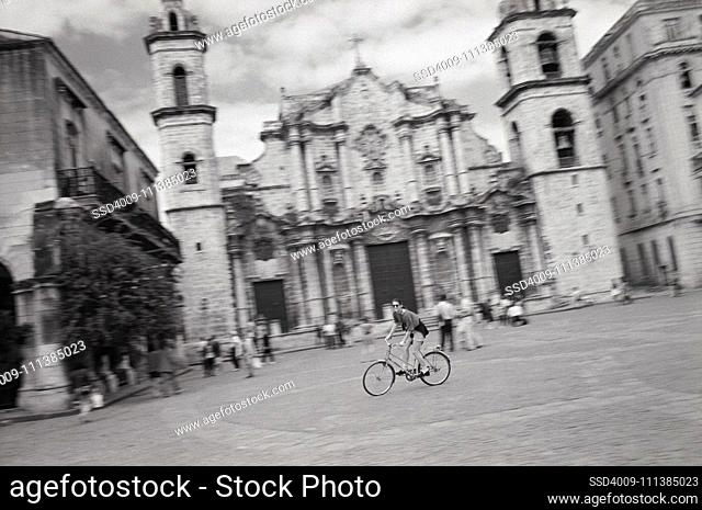 Bicyclist crossing town square