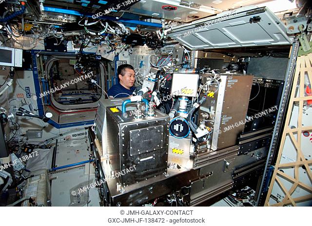 Japan Aerospace Exploration Agency astronaut Koichi Wakata, Expedition 38 flight engineer, works on the Combustion Integrated Rack (CIR) in the Destiny...