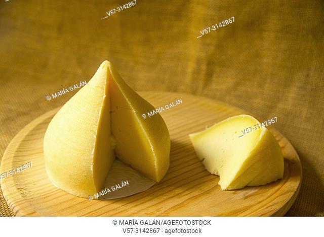 Tetilla cheese cut into pieces. Still life