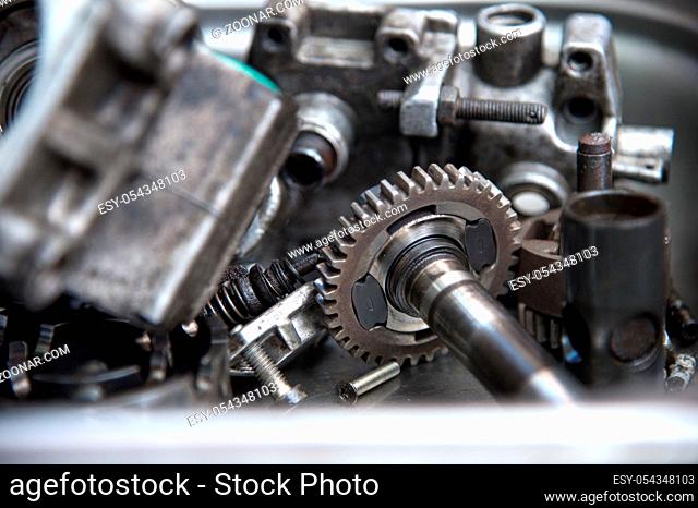 Close up The disassembled mechanical high-pressure diesel pump lies in a metal container. Components of the mechanism. Service of maintenance of diesel...
