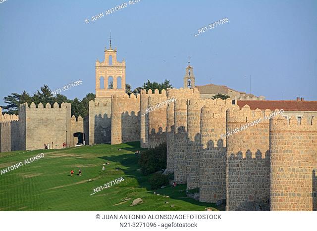 The Espadaña -bell gable- on the left and the walls of the fortified city of Avila, Castilla-Leon, Spain, Europe
