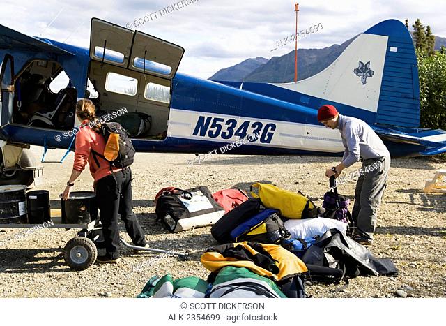 Packing up for the flight through the Brooks Range to the Noatak River, Arctic Alaska; Coldfoot, Alaska, United States of America