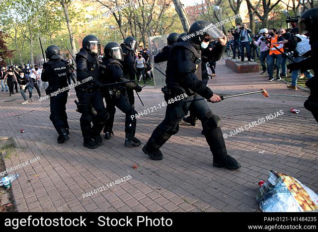 Madrid, Spain; 07.04.2021.- Police receive stones and other objects thrown by neighbors..Vox carries out its first act of electoral pre-campaign in Madrid in...