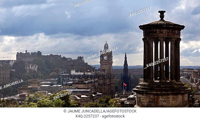 Edinburgh, Scotland. After the rain, when the clouds break, the city lights up with the sunshine, showing a view from Calton Hill towards Edinburgh Castle and...