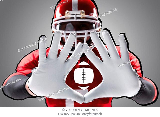 The conceptual image of hands of american football player with ball
