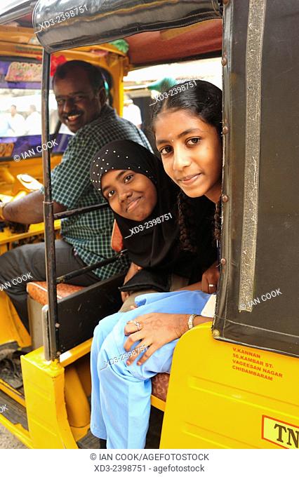 two girls in a tuk-tuk, Chidambaram, Tamil Nadu, India