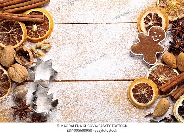 Top view of wooden board with Christmas baking ingredients