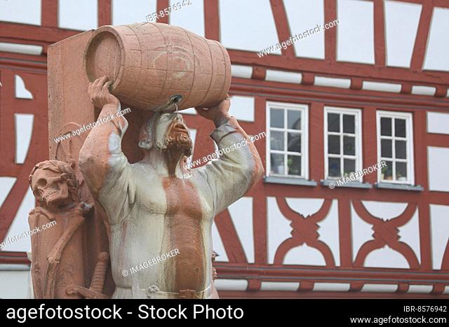 Drunkard fountain, Hattstein fountain with robber baron Friedrich von Hattstein and wine barrel, skull, drink, booze, lift, detail, roach, old town, Limburg
