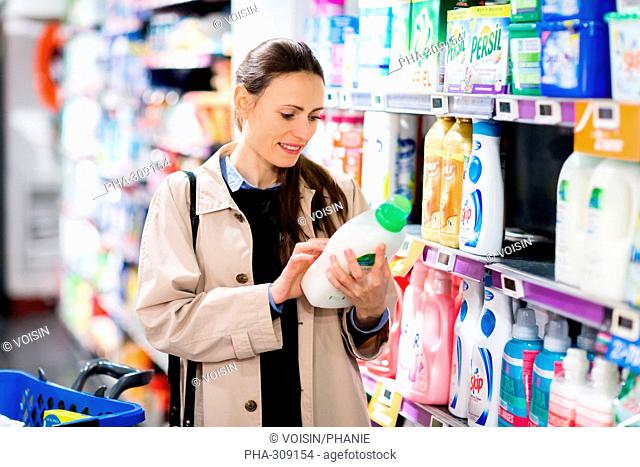 Woman shopping in softening section in supermarket