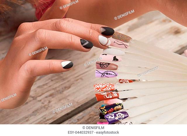 Girl select nail polish Stock Photos and Images | agefotostock