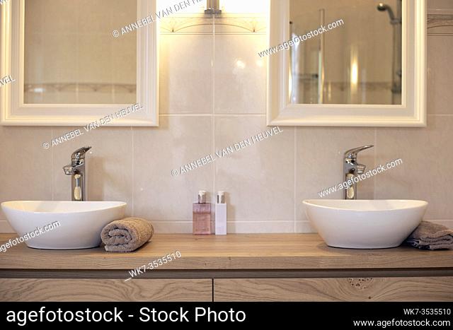 Modern bathroom with two sinks new luxury design with two mirrors close-up