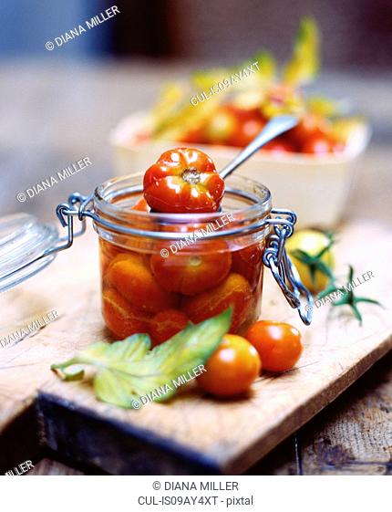 Heritage tomatoes in glass jar