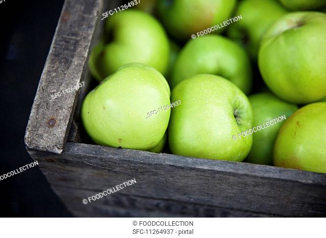 A crate of Granny Smith apples at a market in East London